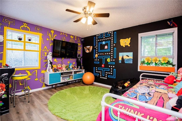 5 Chapel Ln, Bella Vista, AR 72715 - bedroom with wood finished floors, a textured ceiling, and baseboards