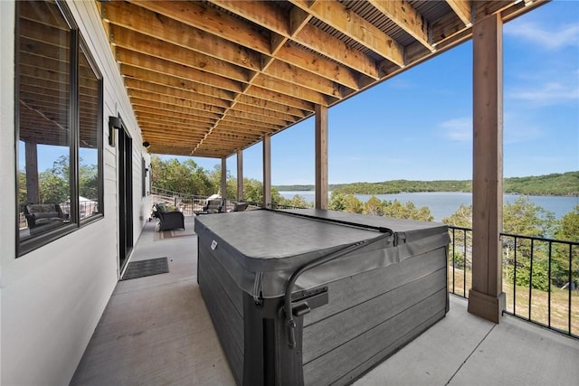 10393 Cedar Rock Rd, Garfield, AR 72732 - view of patio with a water view and a hot tub
