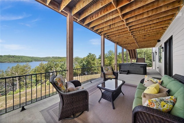 10393 Cedar Rock Rd, Garfield, AR 72732 - view of patio with a hot tub, an outdoor living space, and a water view