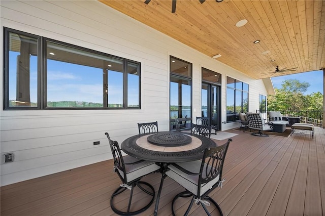 10393 Cedar Rock Rd, Garfield, AR 72732 - wooden deck with ceiling fan, outdoor dining space, and an outdoor hangout area