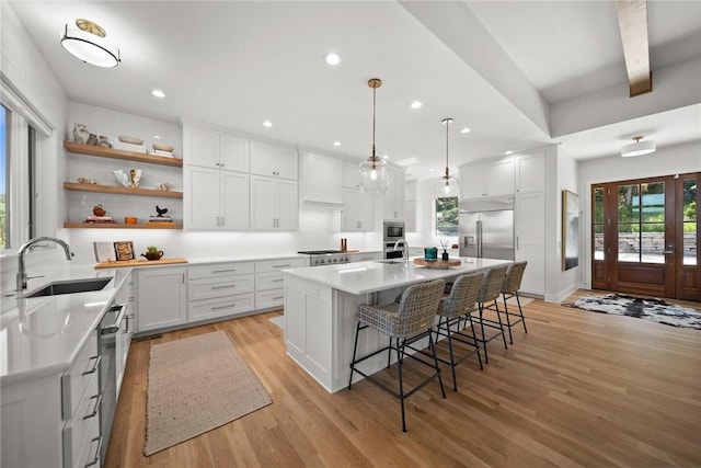 10393 Cedar Rock Rd, Garfield, AR 72732 - kitchen with a sink, appliances with stainless steel finishes, plenty of natural light, light wood-style floors, and recessed lighting