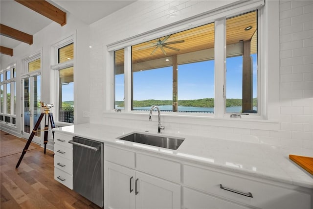 10393 Cedar Rock Rd, Garfield, AR 72732 - kitchen with dishwasher, a sink, beamed ceiling, dark wood finished floors, and decorative backsplash