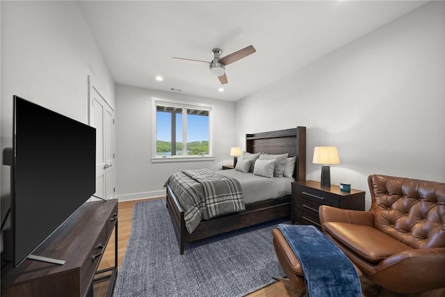 10393 Cedar Rock Rd, Garfield, AR 72732 - bedroom featuring wood finished floors, recessed lighting, baseboards, and a ceiling fan