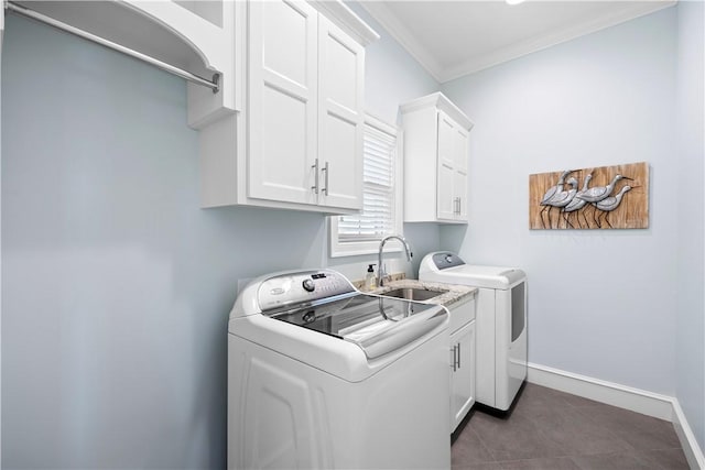 117 Valley View Dr, Russellville, AR 72802 - laundry room with washing machine and clothes dryer, cabinet space, ornamental molding, baseboards, and dark tile patterned flooring