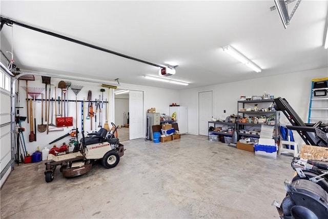 117 Valley View Dr, Russellville, AR 72802 - garage with a garage door opener and freestanding refrigerator