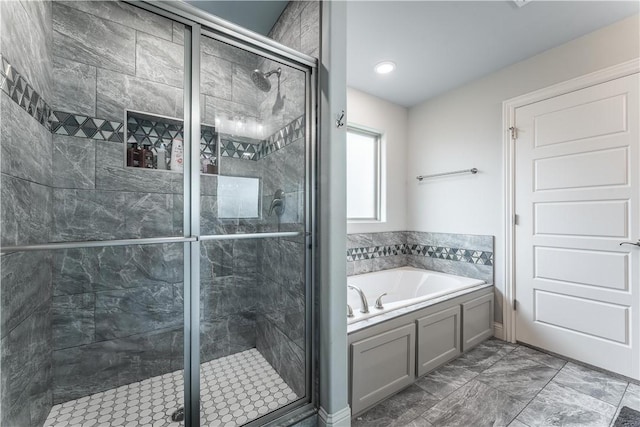 483 N Otoe St, Farmington, AR 72730 - full bathroom with a garden tub, a shower stall, and marble look tiles