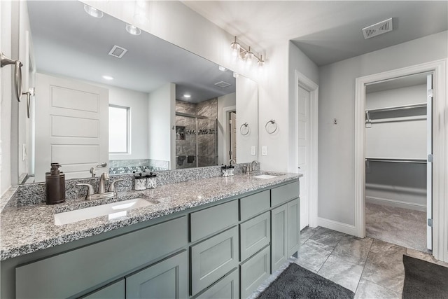 483 N Otoe St, Farmington, AR 72730 - bathroom with a shower stall, a spacious closet, double vanity, baseboards, and marble look tile flooring