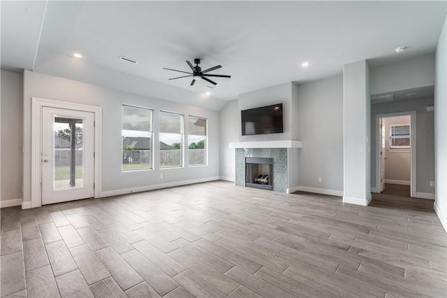 483 N Otoe St, Farmington, AR 72730 - unfurnished living room with a ceiling fan, wood finished floors, a fireplace, baseboards, and recessed lighting