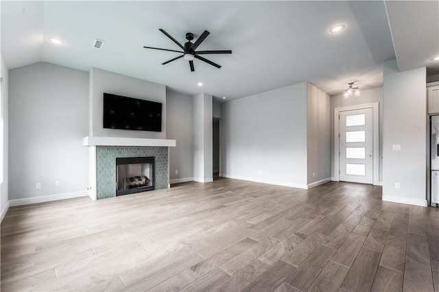 483 N Otoe St, Farmington, AR 72730 - unfurnished living room featuring a ceiling fan, wood finished floors, a fireplace, recessed lighting, and baseboards