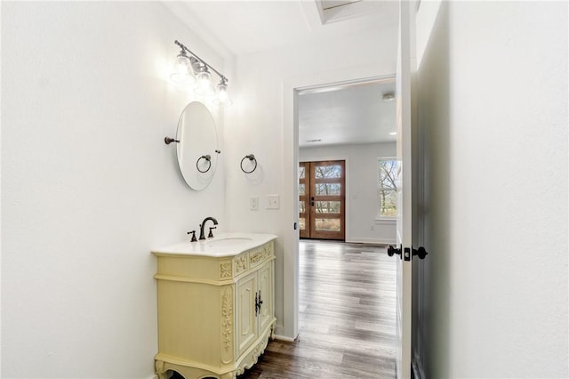 12698 Bush Rd, Centerton, AR 72719 - bathroom featuring vanity, wood finished floors, and baseboards
