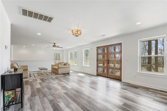 12698 Bush Rd, Centerton, AR 72719 - living area featuring plenty of natural light, wood finished floors, baseboards, and recessed lighting