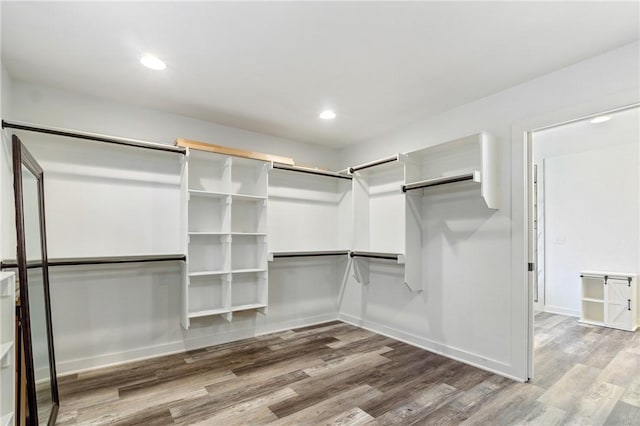 12698 Bush Rd, Centerton, AR 72719 - walk in closet featuring wood finished floors
