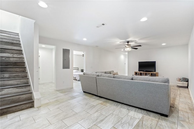 12698 Bush Rd, Centerton, AR 72719 - living area featuring stairway, ceiling fan, electric panel, recessed lighting, and baseboards