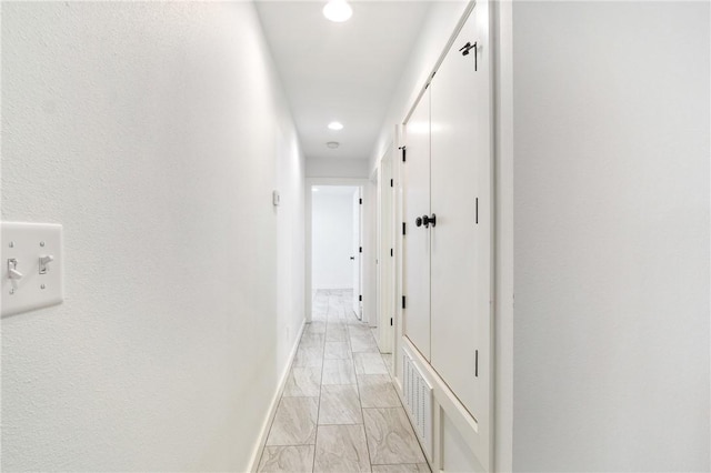 12698 Bush Rd, Centerton, AR 72719 - hallway with light marble finish floors, recessed lighting, and baseboards