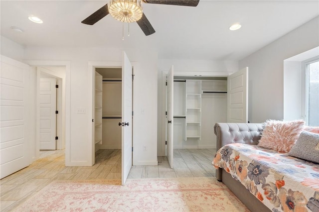 12698 Bush Rd, Centerton, AR 72719 - bedroom with a spacious closet, recessed lighting, a ceiling fan, a closet, and baseboards