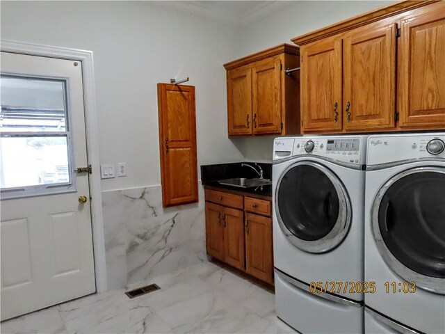 4007 Georgia St, Springdale, AR 72762 - laundry room with cabinet space, independent washer and dryer, ornamental molding, light marble finish flooring, and a wainscoted wall