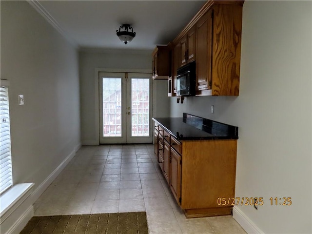 4007 Georgia St, Springdale, AR 72762 - kitchen with black microwave, dark countertops, french doors, plenty of natural light, and crown molding