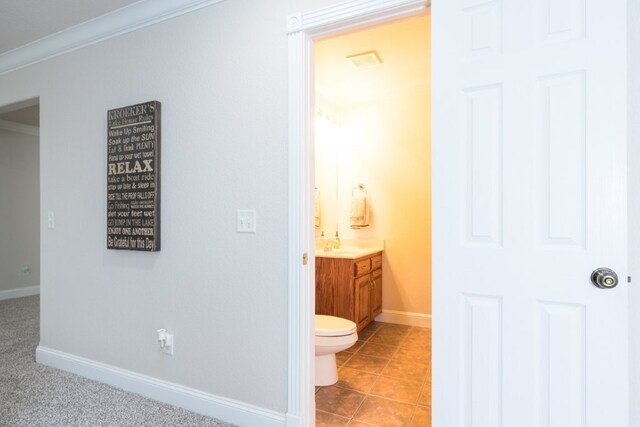 15210 Haynes Rd, Rogers, AR 72756 - bathroom with vanity, baseboards, toilet, and crown molding