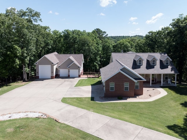 15210 Haynes Rd, Rogers, AR 72756 - view of front of property featuring driveway, a porch, a front lawn, brick siding, and a garage