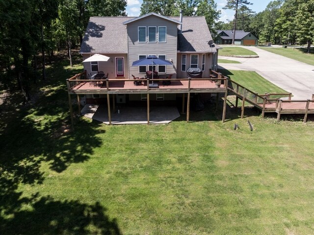15210 Haynes Rd, Rogers, AR 72756 - rear view of house with a deck, a lawn, and a shingled roof