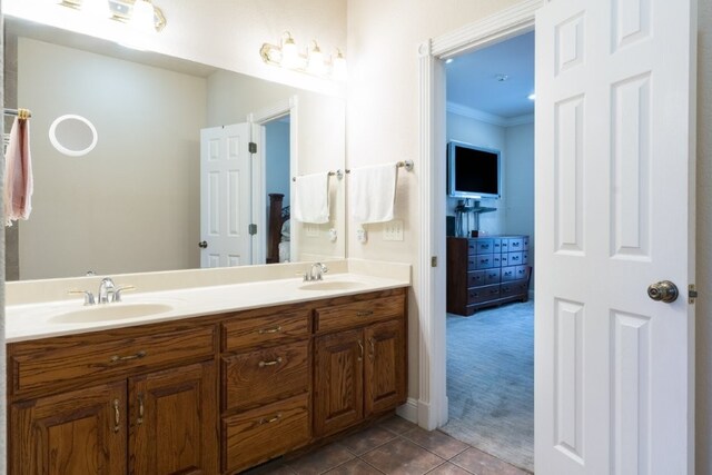 15210 Haynes Rd, Rogers, AR 72756 - bathroom with double vanity, tile patterned flooring, and ornamental molding