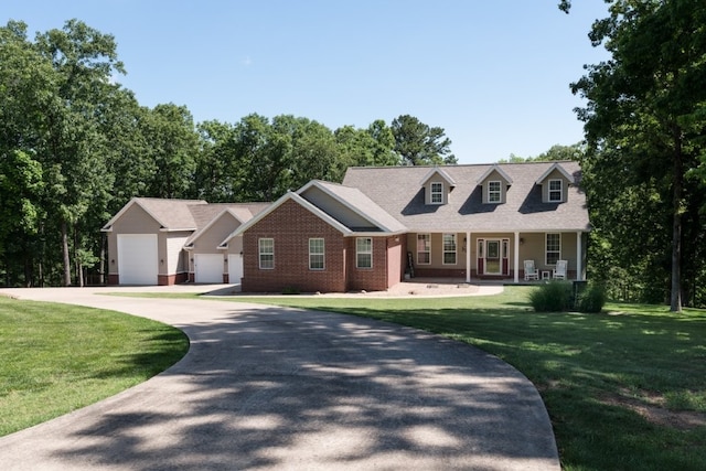 15210 Haynes Rd, Rogers, AR 72756 - new england style home featuring a front lawn, brick siding, covered porch, and concrete driveway