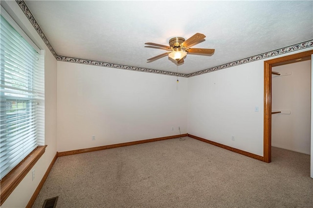 17 La Costa Dr, Holiday Island, AR 72631 - carpeted empty room with a ceiling fan and baseboards