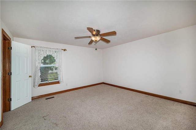 17 La Costa Dr, Holiday Island, AR 72631 - empty room featuring baseboards, carpet, and ceiling fan