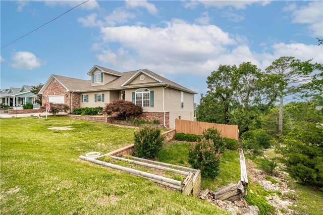 17 La Costa Dr, Holiday Island, AR 72631 - view of front of home with a garage and brick siding