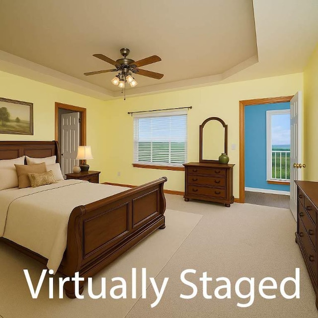 17 La Costa Dr, Holiday Island, AR 72631 - bedroom with baseboards, light carpet, a raised ceiling, and ceiling fan