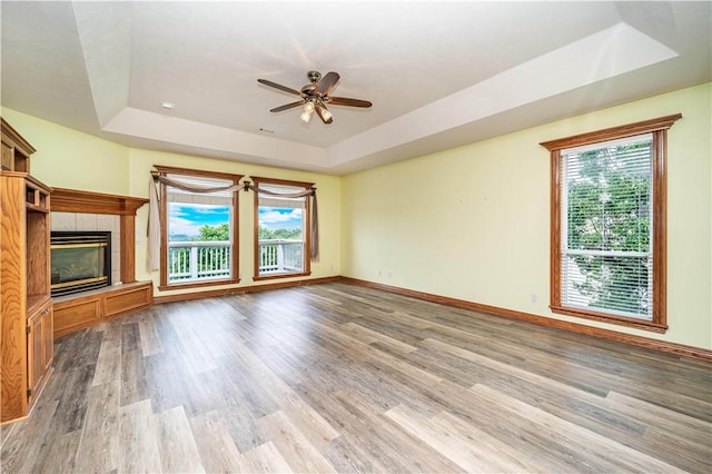17 La Costa Dr, Holiday Island, AR 72631 - unfurnished living room with a raised ceiling, wood finished floors, and plenty of natural light