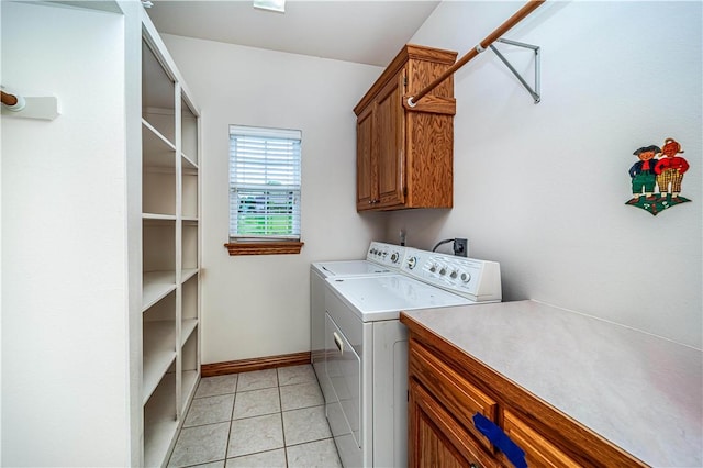 17 La Costa Dr, Holiday Island, AR 72631 - laundry area with cabinet space, washer and clothes dryer, baseboards, and light tile patterned floors