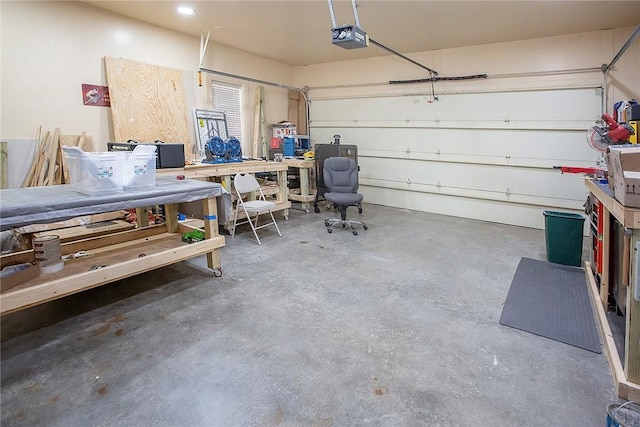 1060 Marina Way, Russellville, AR 72801 - garage featuring a garage door opener and a workshop area