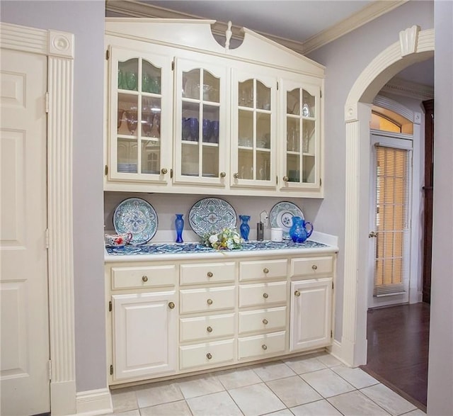 1060 Marina Way, Russellville, AR 72801 - bar with arched walkways, ornamental molding, light tile patterned floors, and baseboards