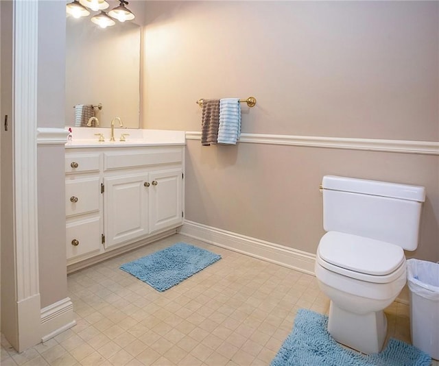 1060 Marina Way, Russellville, AR 72801 - bathroom with baseboards, toilet, and vanity