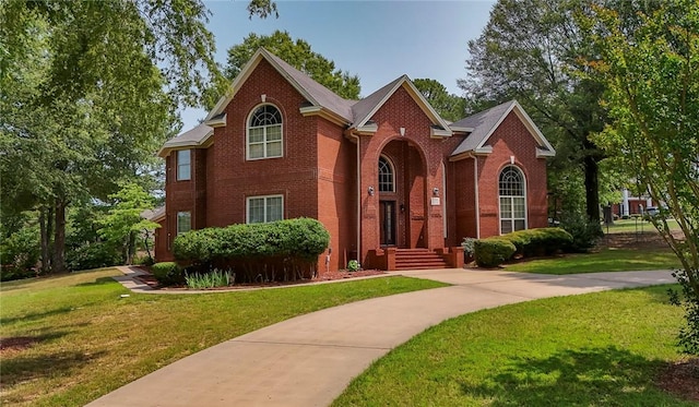 1060 Marina Way, Russellville, AR 72801 - view of front facade featuring brick siding and a front lawn