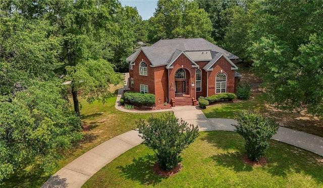 1060 Marina Way, Russellville, AR 72801 - traditional home with brick siding, a front lawn, and a forest view