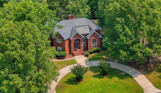 1060 Marina Way, Russellville, AR 72801 - traditional home featuring a front lawn, brick siding, and a chimney