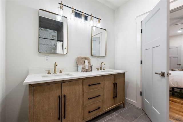 327 S E Ave, Fayetteville, AR 72701 - full bath featuring double vanity, tile patterned floors, curtained shower, and connected bathroom