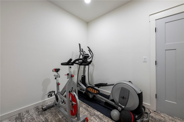 327 S E Ave, Fayetteville, AR 72701 - workout room featuring baseboards and wood finished floors