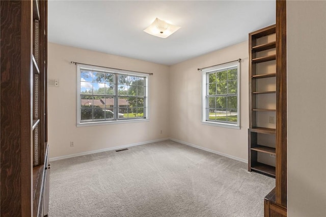 5 Rolling Meadows Dr, Harrison, AR 72601 - unfurnished bedroom with multiple windows, baseboards, and carpet floors
