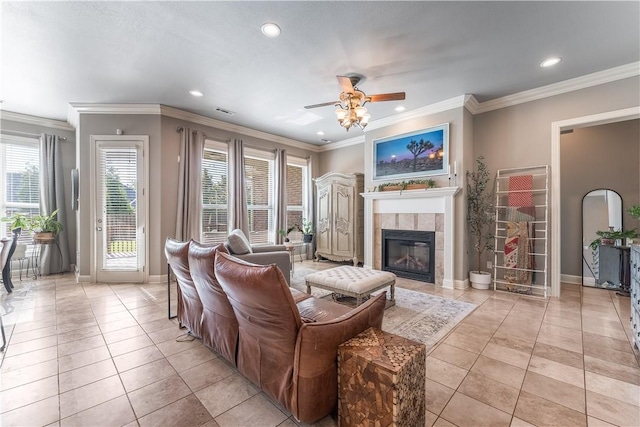 2314 S The Peaks Blvd, Rogers, AR 72758 - living area featuring a ceiling fan, recessed lighting, a tiled fireplace, light tile patterned flooring, and ornamental molding