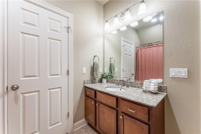 2314 S The Peaks Blvd, Rogers, AR 72758 - full bathroom with vanity, a textured wall, and tile patterned flooring