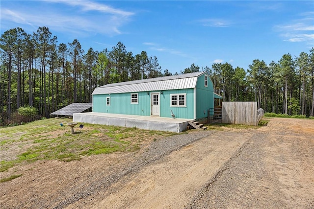 439 Pine Twist, Russellville, AR 72802 - view of front of home featuring metal roof, solar panels, and driveway