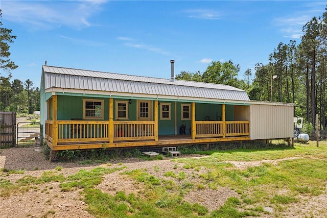 439 Pine Twist, Russellville, AR 72802 - rear view of house featuring covered porch and metal roof
