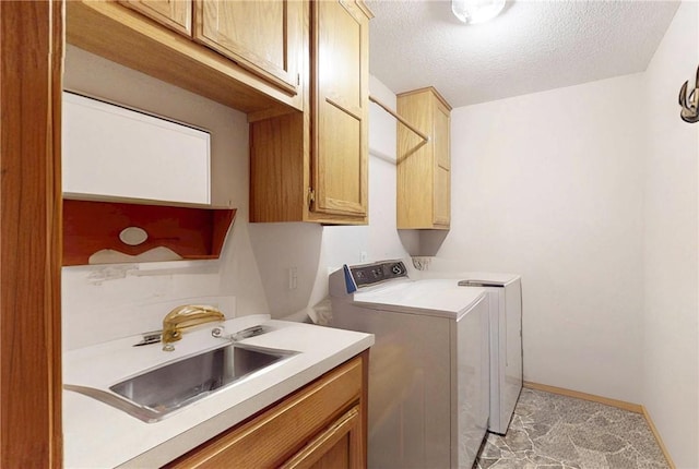 15829 N Wimpy Jones Rd, Garfield, AR 72732 - laundry room featuring separate washer and dryer, cabinet space, a textured ceiling, and baseboards