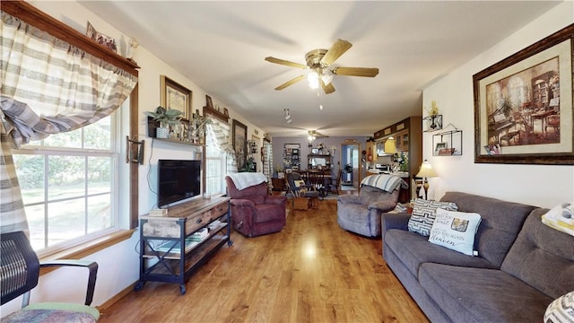 15829 N Wimpy Jones Rd, Garfield, AR 72732 - living room featuring a ceiling fan and wood finished floors