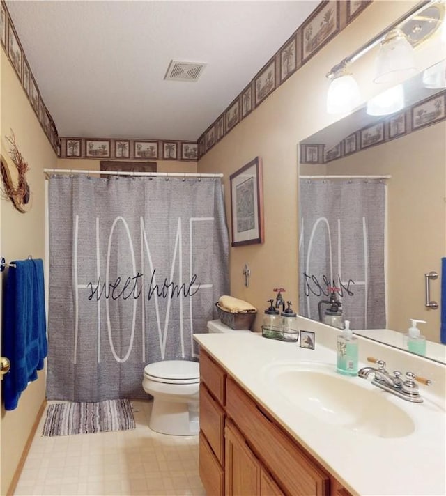 15829 N Wimpy Jones Rd, Garfield, AR 72732 - bathroom with vanity, toilet, tile patterned floors, and a shower with curtain