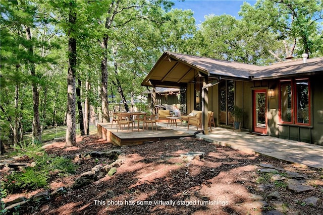 1463 E Woodbrook Dr, Fayetteville, AR 72703 - back of property with a deck and a shingled roof