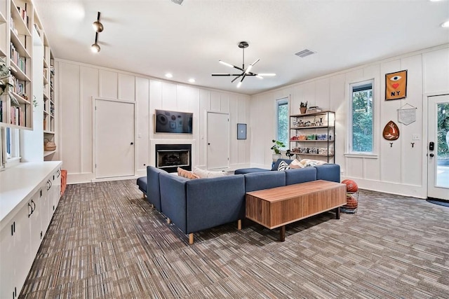 1463 E Woodbrook Dr, Fayetteville, AR 72703 - living room with a decorative wall, a fireplace, ceiling fan, and recessed lighting